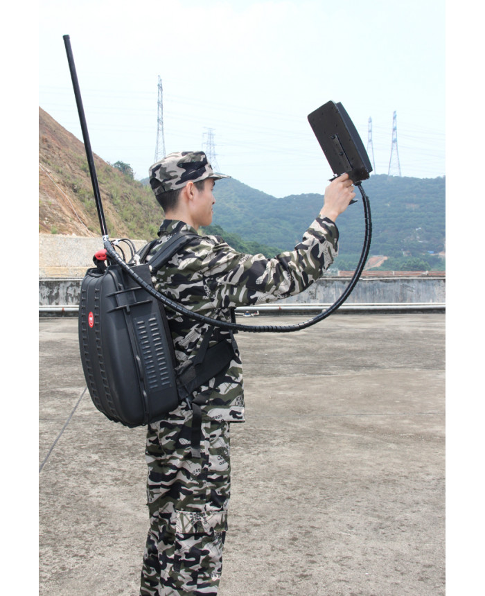 operator using backpack drone jammer outdoor